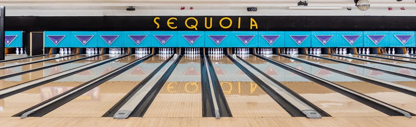Bowling lanes at Sequoia Pro Bowl with the venue name above the pin decks